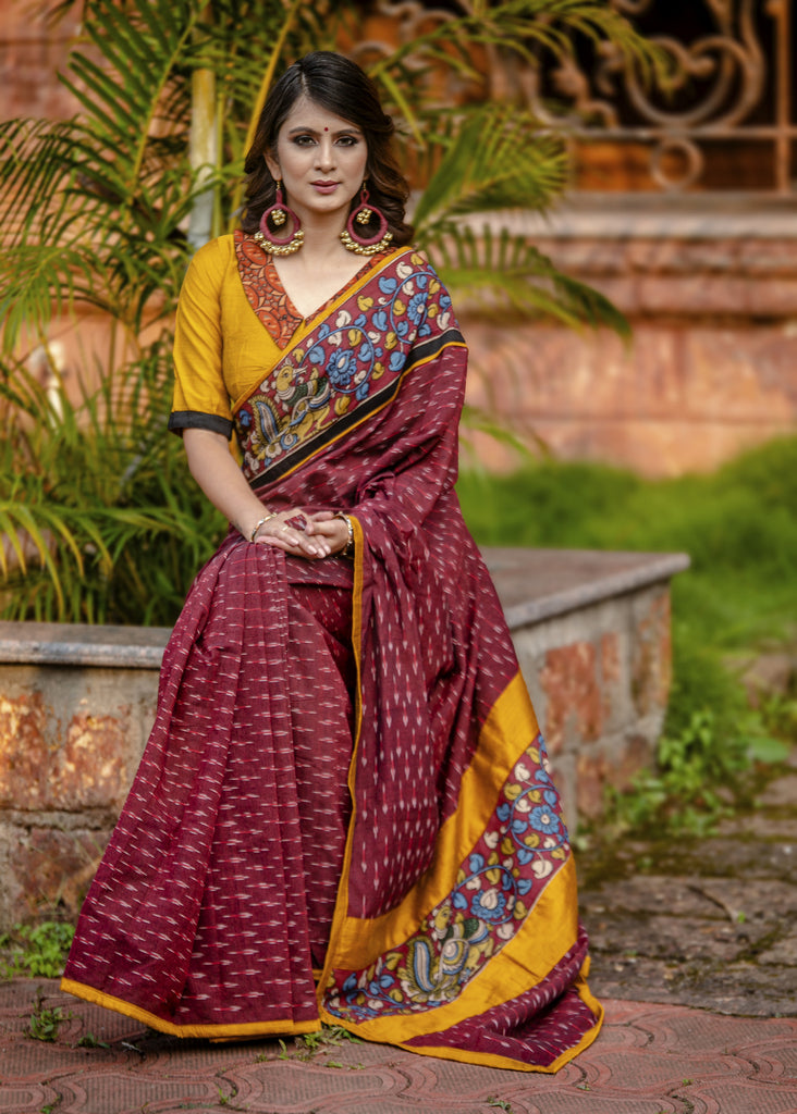 Exclusive maroon ikat saree with hand painted kalamkar border