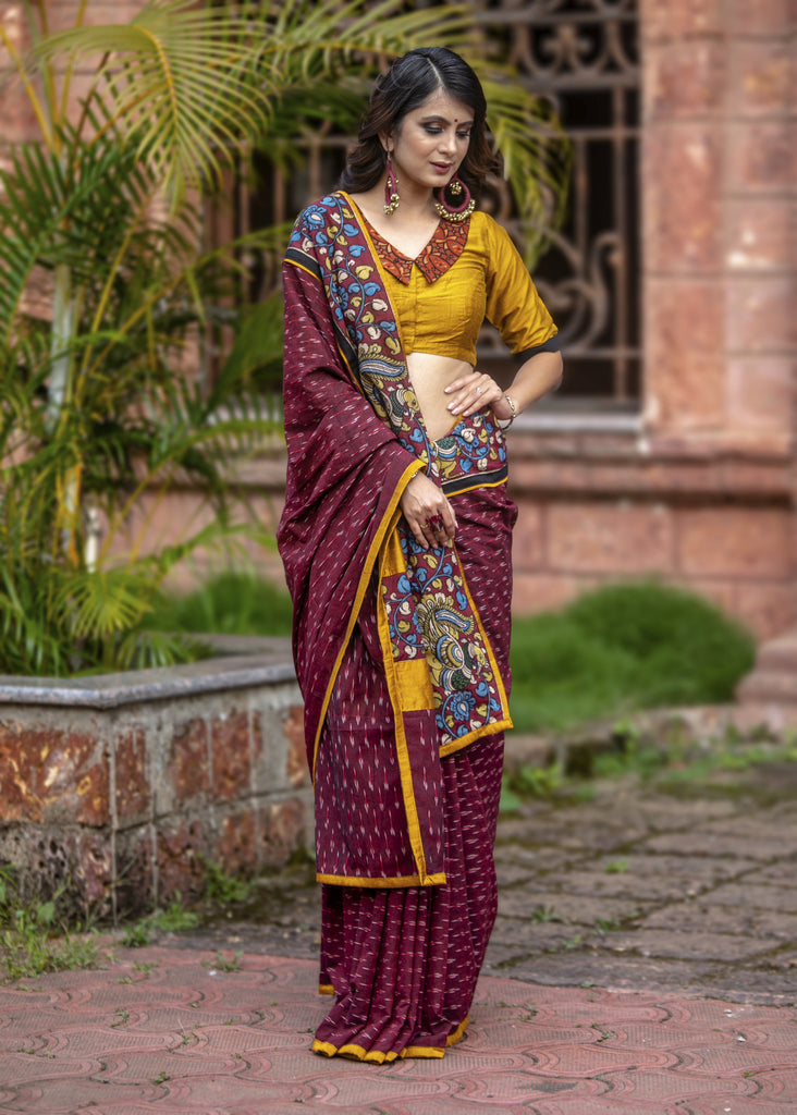 Exclusive maroon ikat saree with hand painted kalamkar border