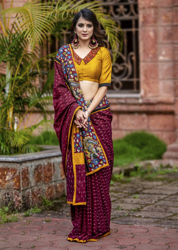 Exclusive maroon ikat saree with hand painted kalamkar border