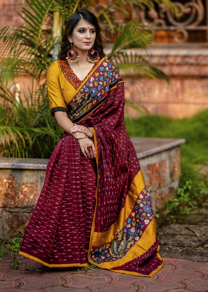 Exclusive maroon ikat saree with hand painted kalamkar border