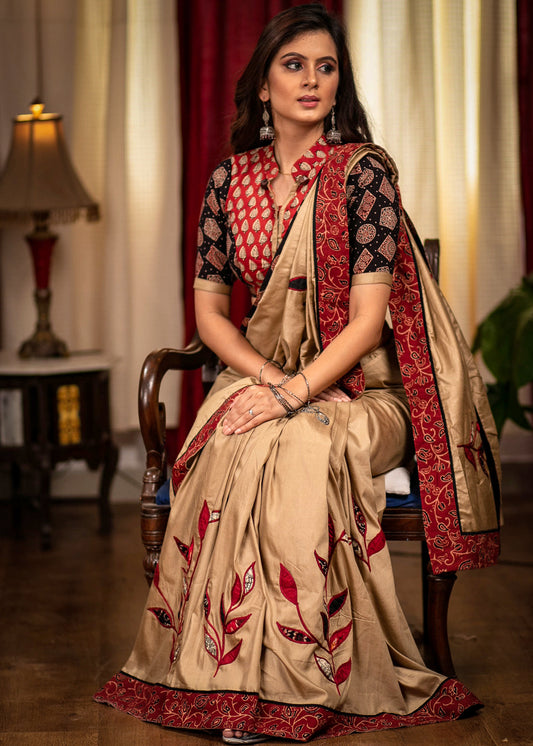 Beige semi silk saree with exclusive hand applique work