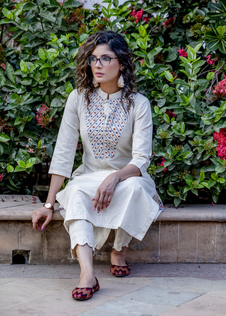 Off-white hand embroidered straight cut handloom cotton kurta with sequence work