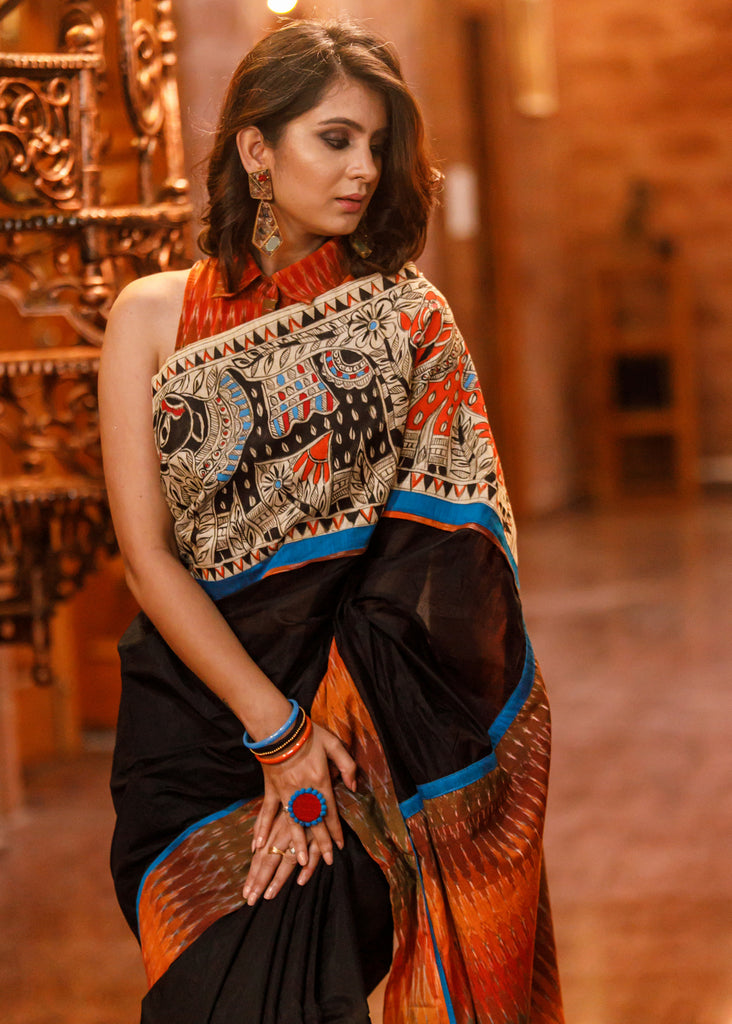 Black chanderi saree with exlcuisve hand painted madhubani painting & ikat border