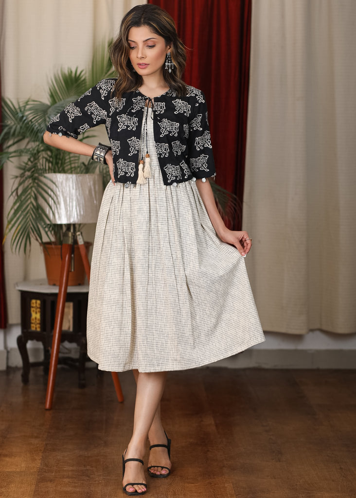 Ivory ikat dress with black cow print attached jacket and coin embellishments