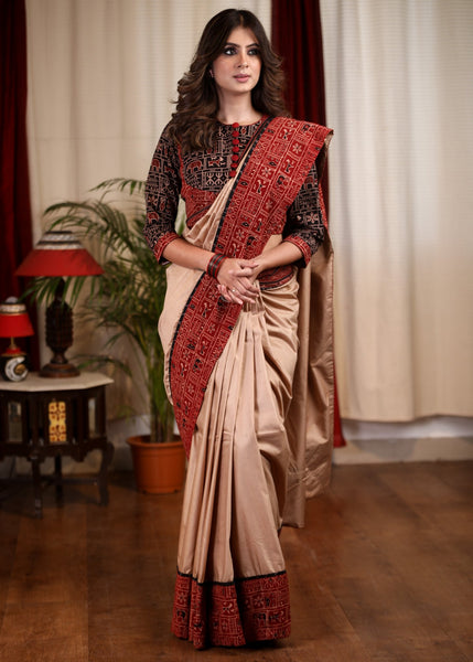 Beige silk cotton saree with block printed Ajrakh border