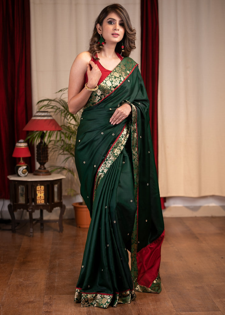 Forest green satin saree with benarasi border & mirrror work all over