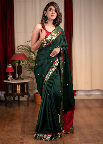 Forest green satin saree with benarasi border & mirrror work all over