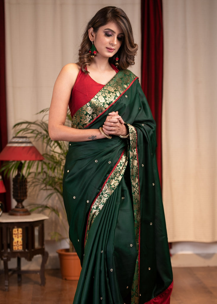 Forest green satin saree with benarasi border & mirrror work all over