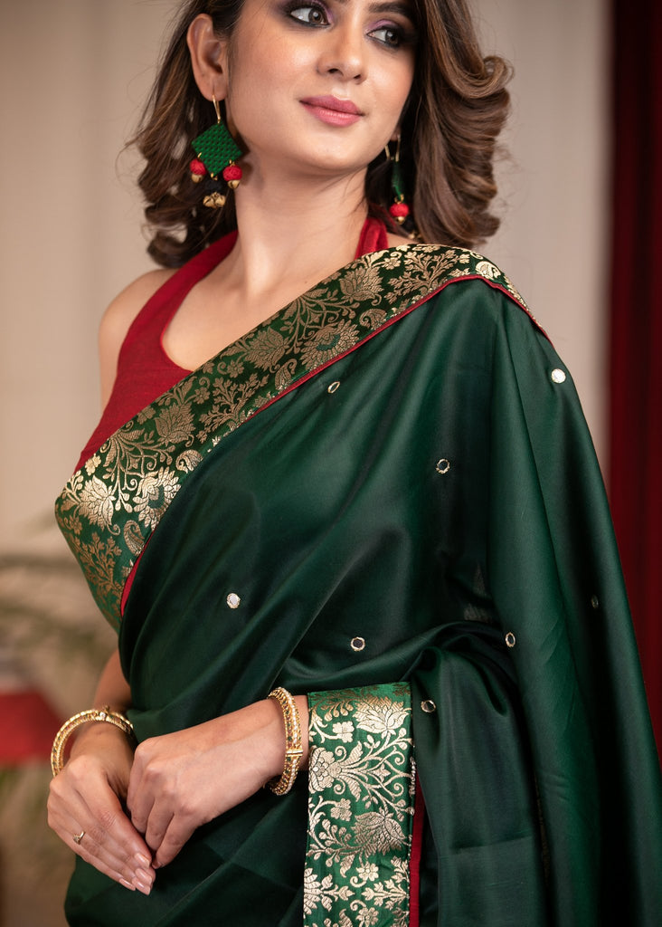 Forest green satin saree with benarasi border & mirrror work all over