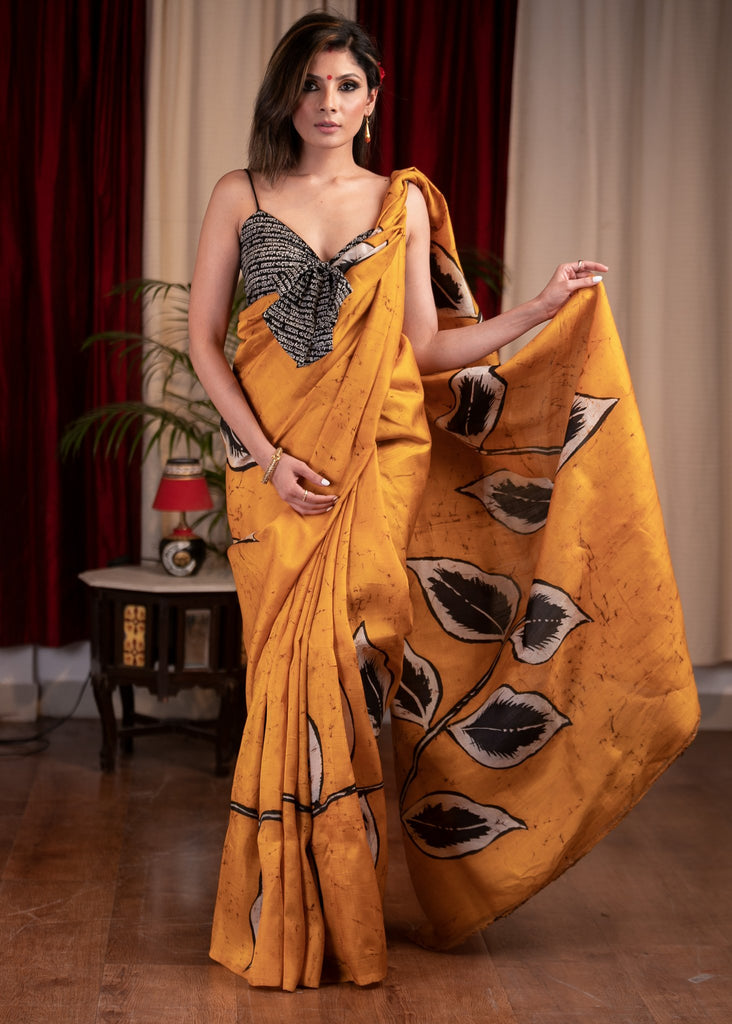 Exclusive hand batik pure silk mustard saree with abstract leaf motifs