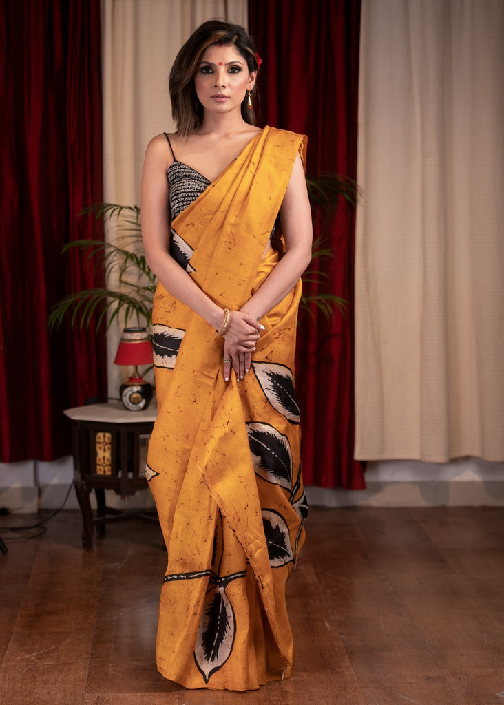 Exclusive hand batik pure silk mustard saree with abstract leaf motifs