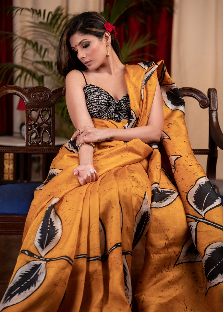 Exclusive hand batik pure silk mustard saree with abstract leaf motifs