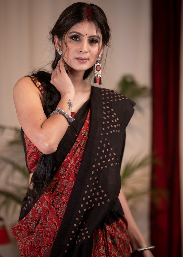 Exclusive maroon Ajrakh saree with Bandhej border