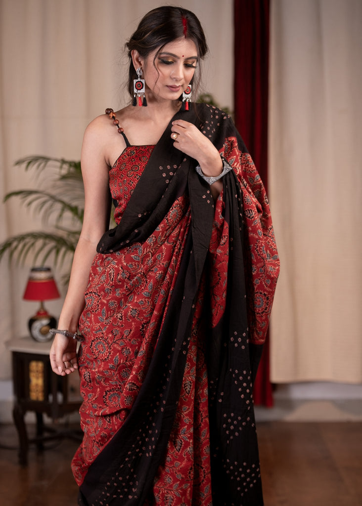 Exclusive maroon Ajrakh saree with Bandhej border