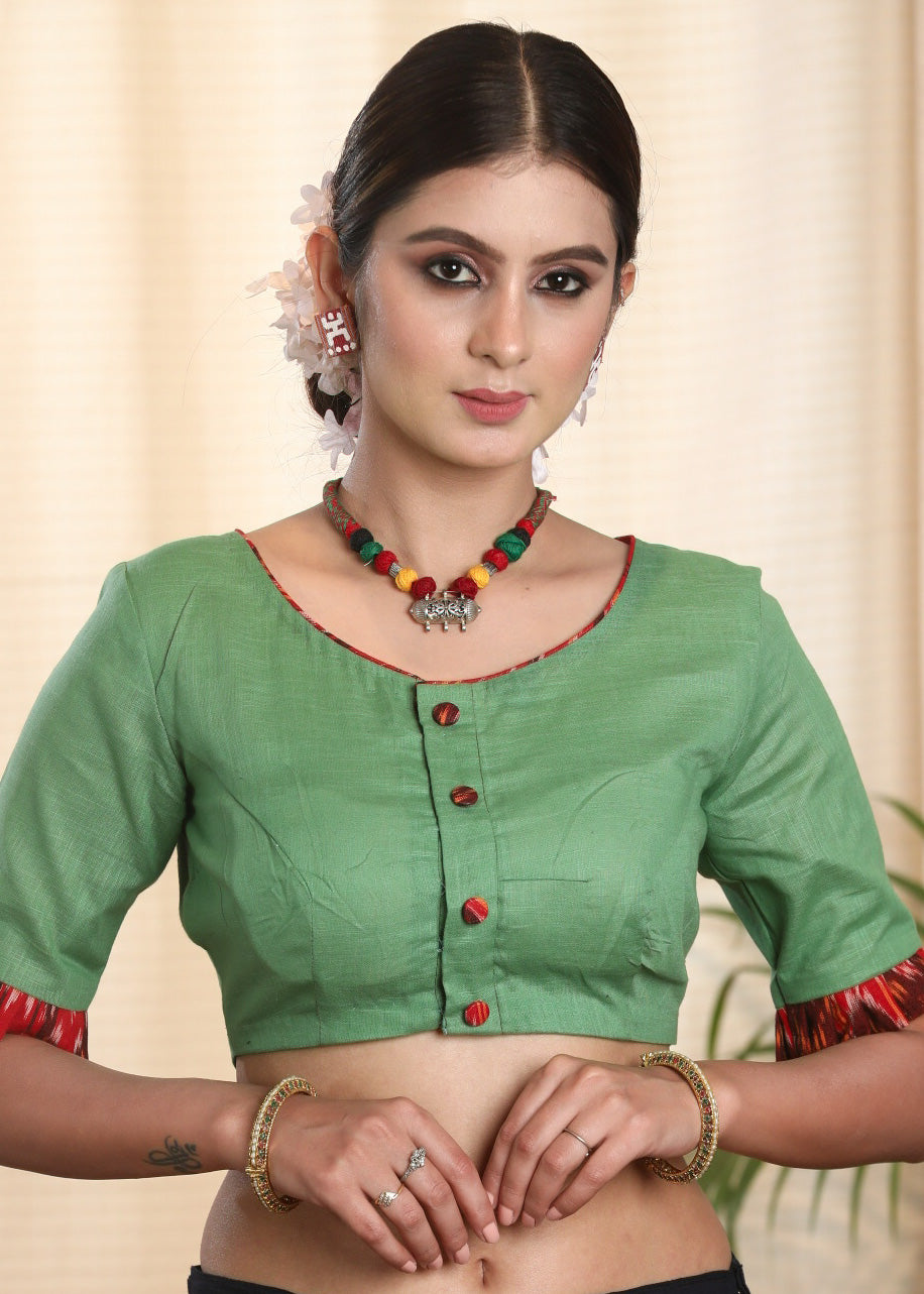 Light Green Pure Cotton-Slub Blouse with Ikat and Calming hand painted Motif on the Back Side.