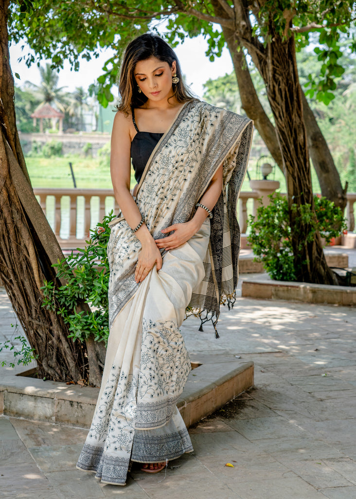 Classic semi sillk heavy embroidered off white saree