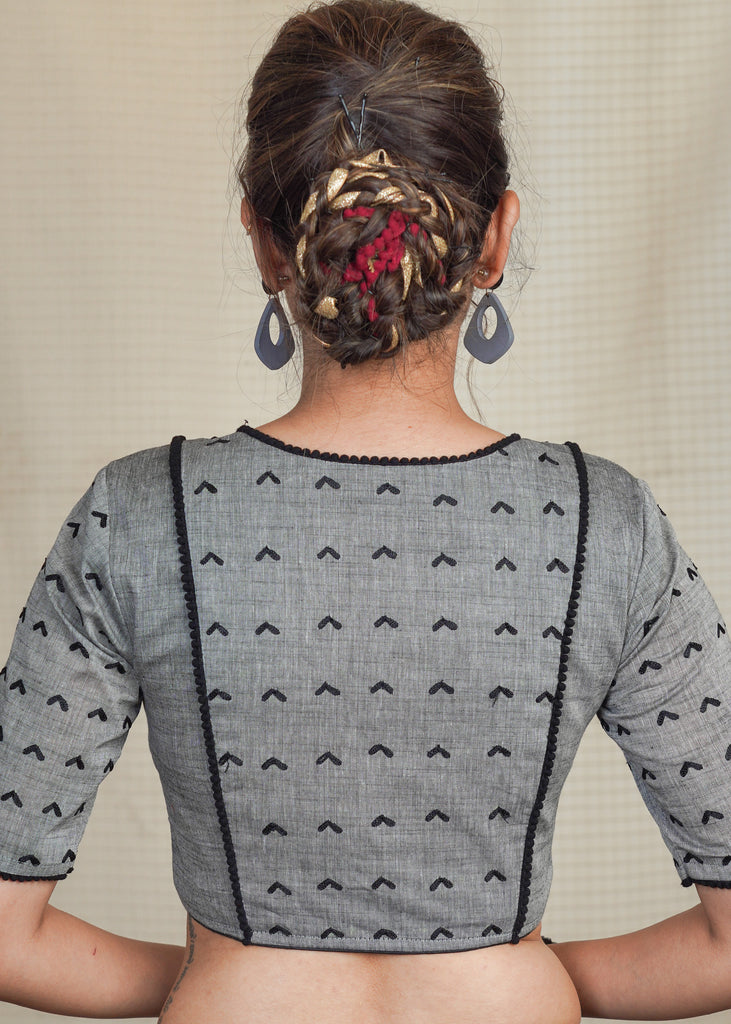 Grey Cotton Handloom Blouse with Embroidery work all over and pom pom lace . Lining Given