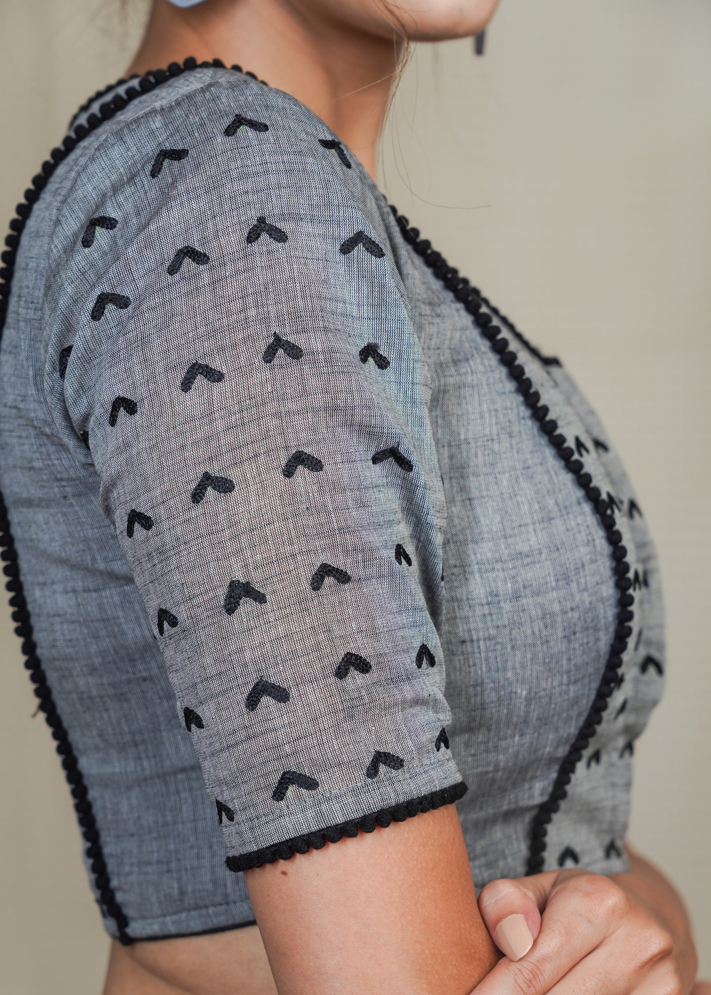 Grey Cotton Handloom Blouse with Embroidery work all over and pom pom lace . Lining Given