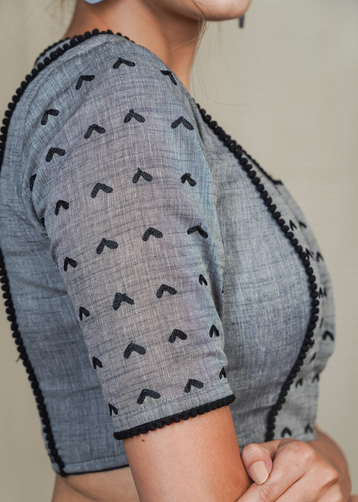Grey Cotton Handloom Blouse with Embroidery work all over and pom pom lace . Lining Given