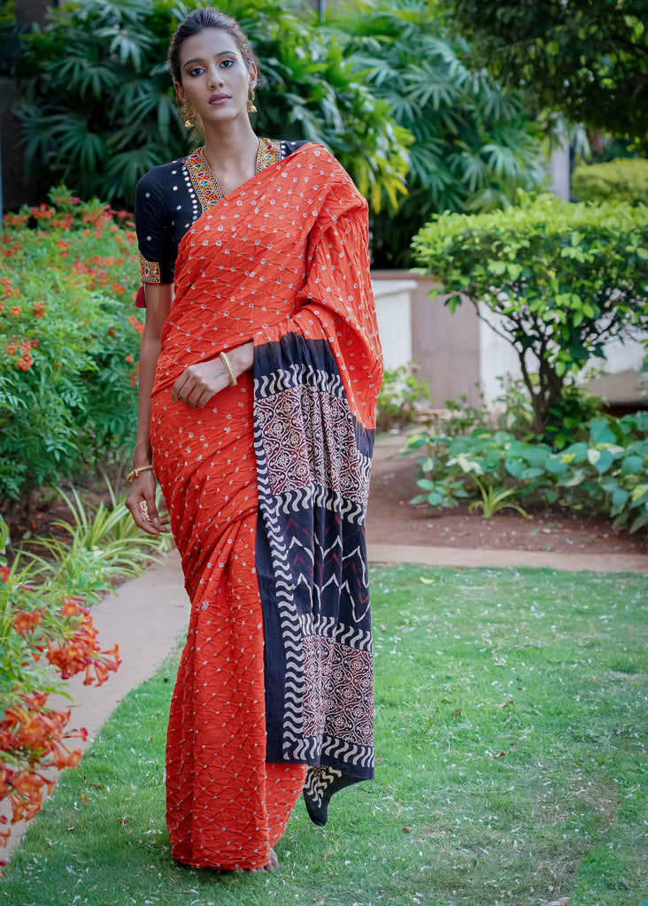 Beautiful orange cotton saree with exclusive Ajrakh & Bandhej combination