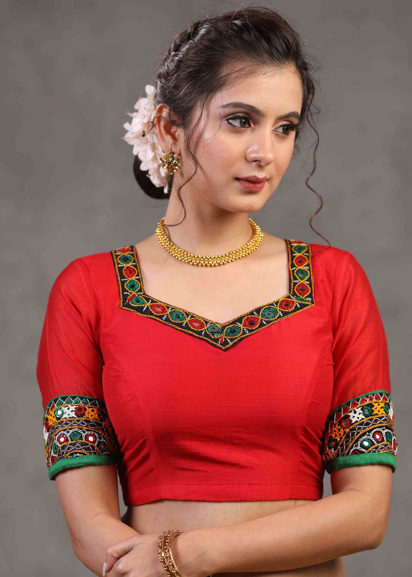 Elegant Red Cotton Silk Blouse Highlighted with Kutch Mirror Work Patch on Sleeves and Neckline