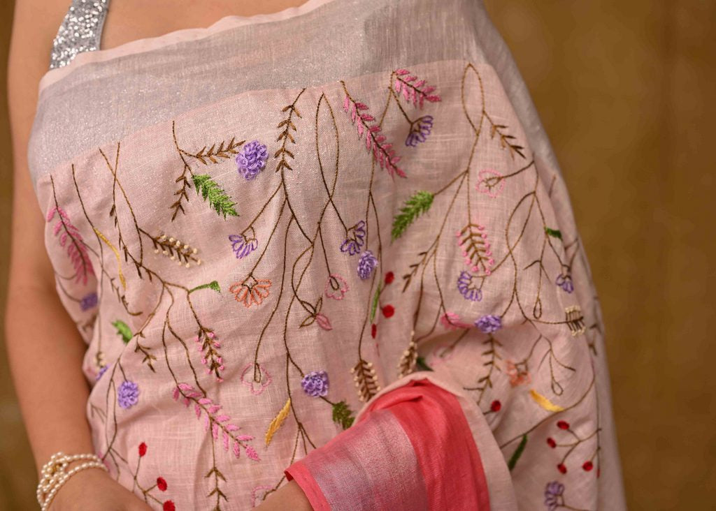 Exclusive Pink Linen Saree with Hand Embroidery and Zari Border