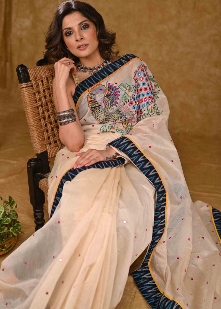 Cream Chanderi Saree with Delicate Peacock Motif Embroidery and Blue Ikaat Border