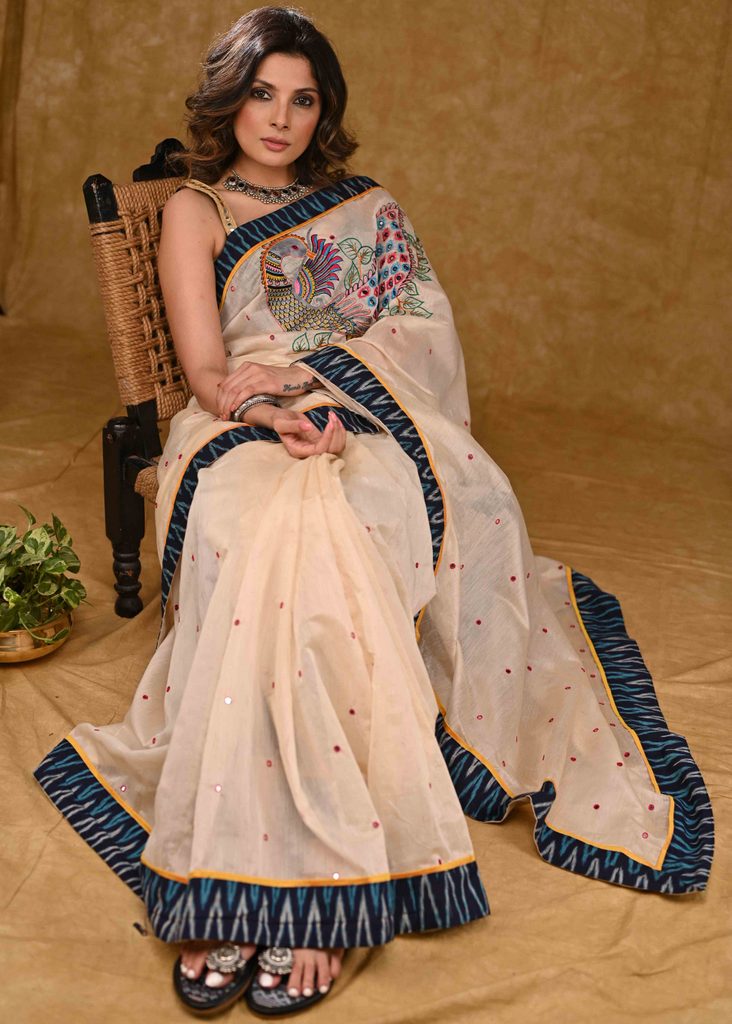 Cream Chanderi Saree with Delicate Peacock Motif Embroidery and Blue Ikaat Border