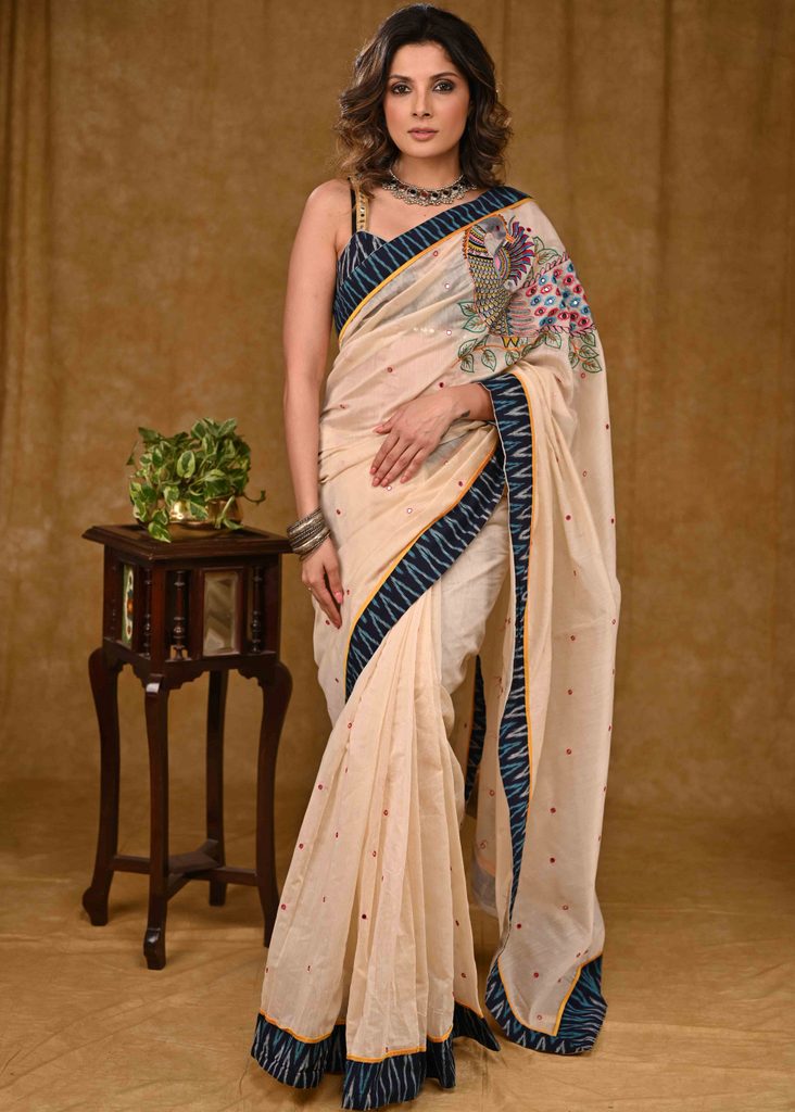 Cream Chanderi Saree with Delicate Peacock Motif Embroidery and Blue Ikaat Border