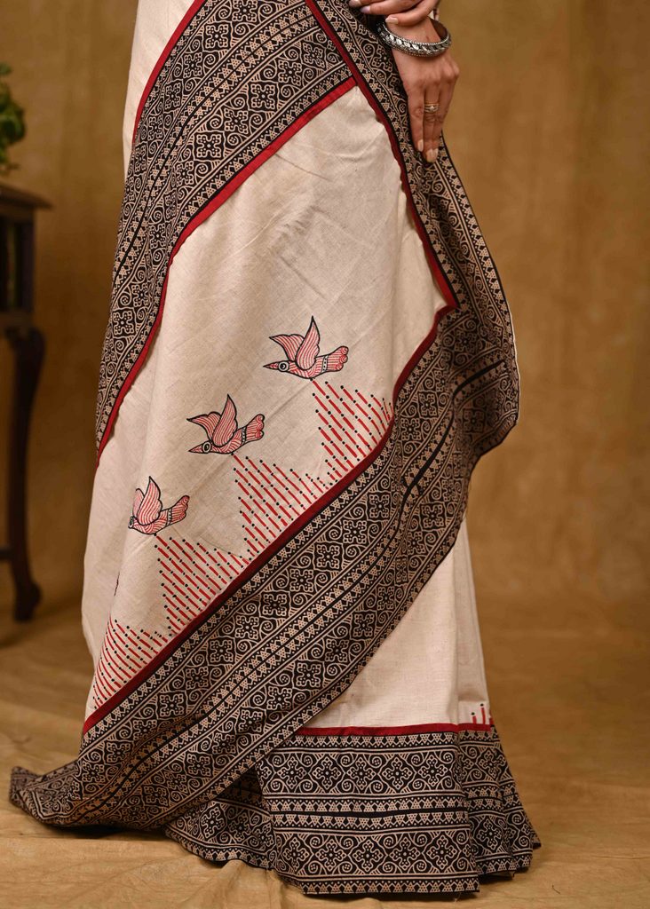 Cream Cotton Saree with Elegant Ajrakh Border and Gond Painting