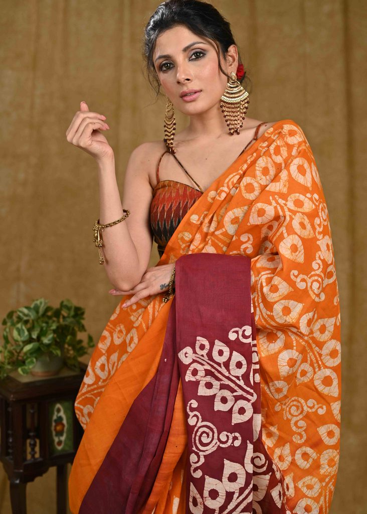 Orange and maroon dyed Exclusive hand Batik cotton saree