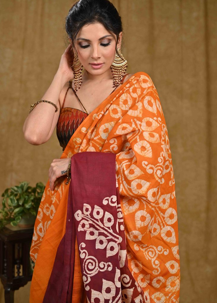 Orange and maroon dyed Exclusive hand Batik cotton saree
