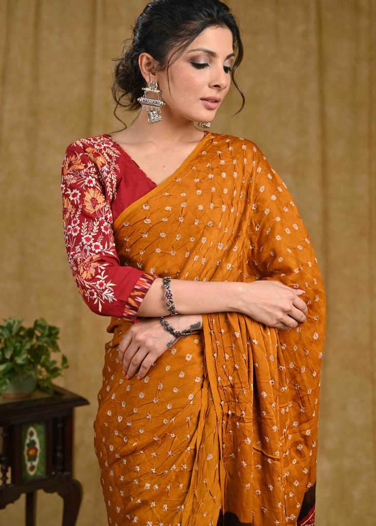 Exclusive modal silk Bandhej saree with Ajrakh block printed border & pallu