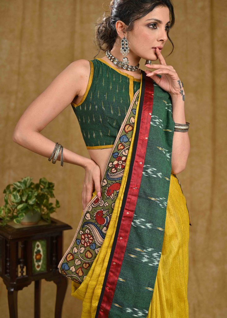 Stunning yellow Ghicha silk saree with Madhubani pallu and green Ikaat border