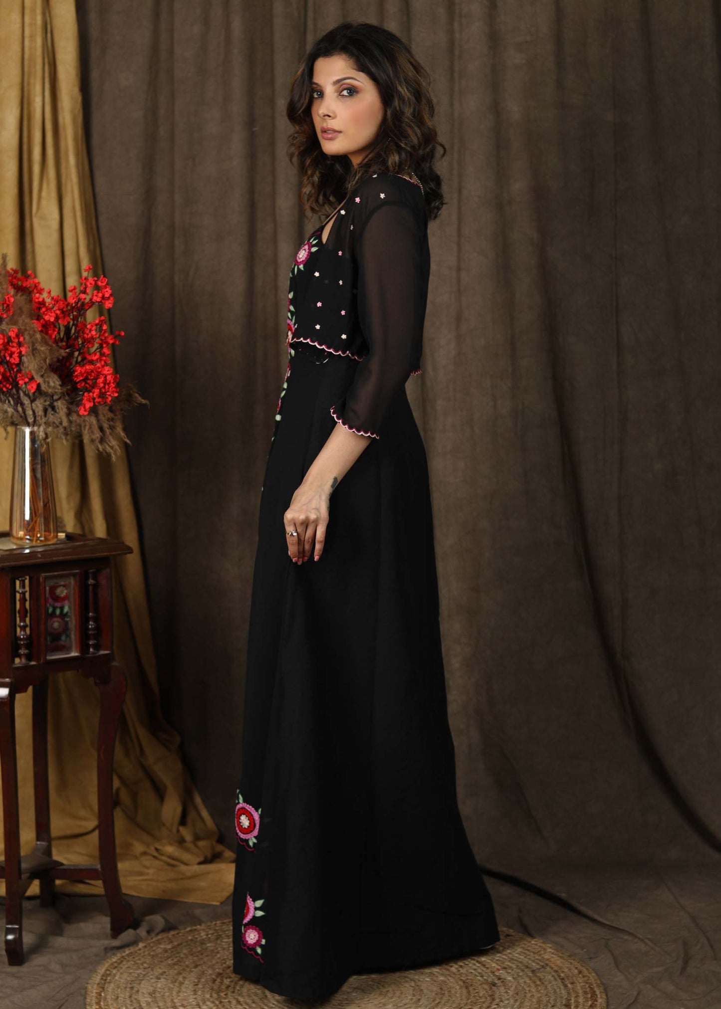 Classy black boho inspired strappy maxi dress with floral embroidery on front layer with optional georgette shrug