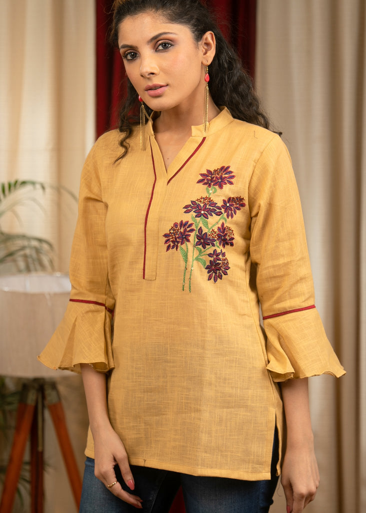 Exclusive yellow cotton top with floral embroidered motifs