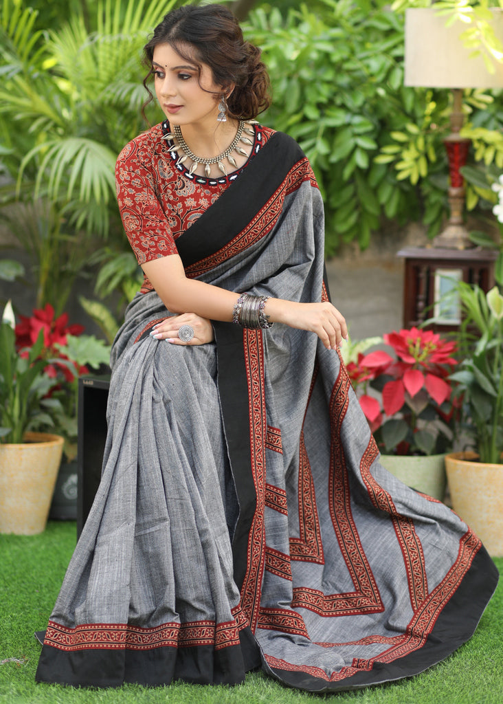 Slate grey Cotton saree with beautiful Ajrakh lines in the Pallu highlighted with black border