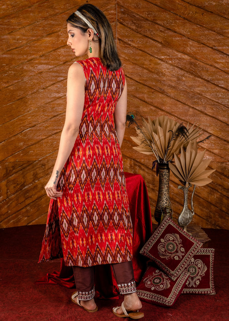Exclusive sleeveless ikat kurta with heavy hand embroidery on neckline.