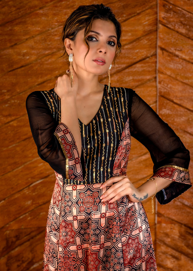 Exclusive mashuru silk block printed Ajrakh gown with hand embroidered yoke.