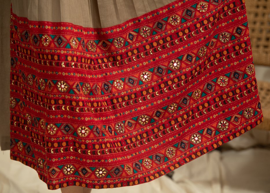 Dark beige cotton dress with pleats yok & hand embroidered embellishments on printed skirt