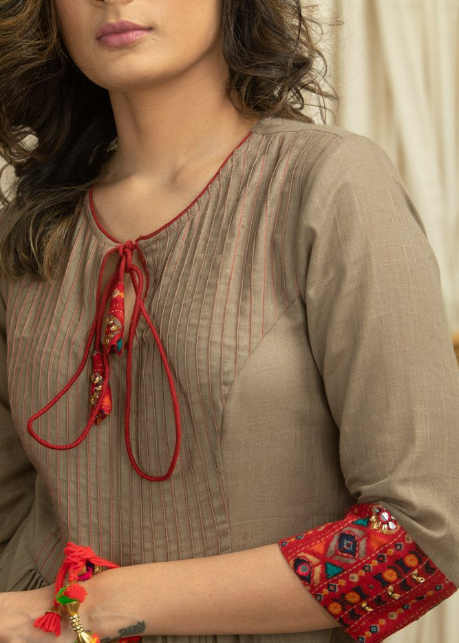 Dark beige cotton dress with pleats yok & hand embroidered embellishments on printed skirt