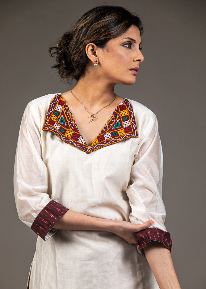 Exclusive white chanderi top with hand embroidered kutchi mirror work collar