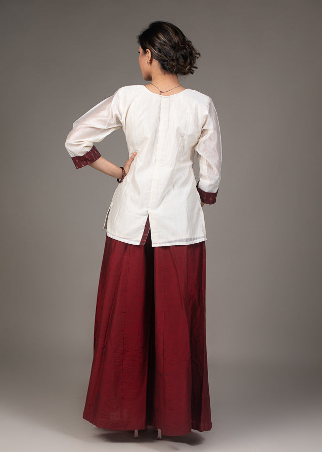 Exclusive white chanderi top with hand embroidered kutchi mirror work collar