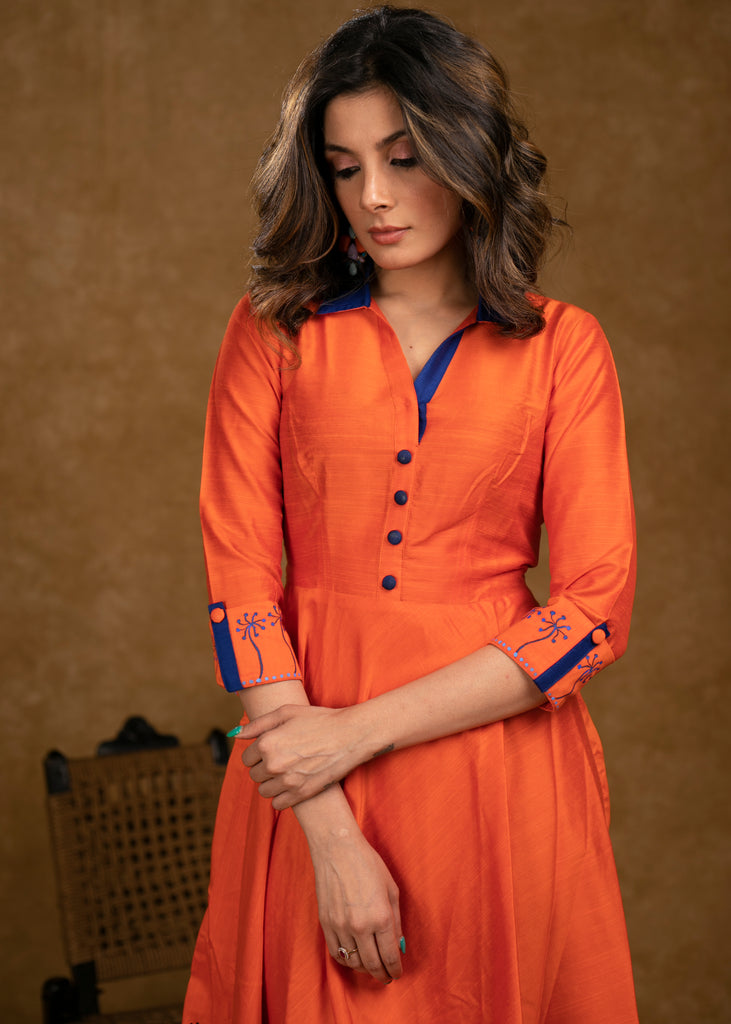Exclusive Orange Cotton Silk Dress with Gond Painting on Hemline and Sleeves