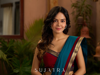 Teal cotton saree with Kalamkari border and rich khun border detailing