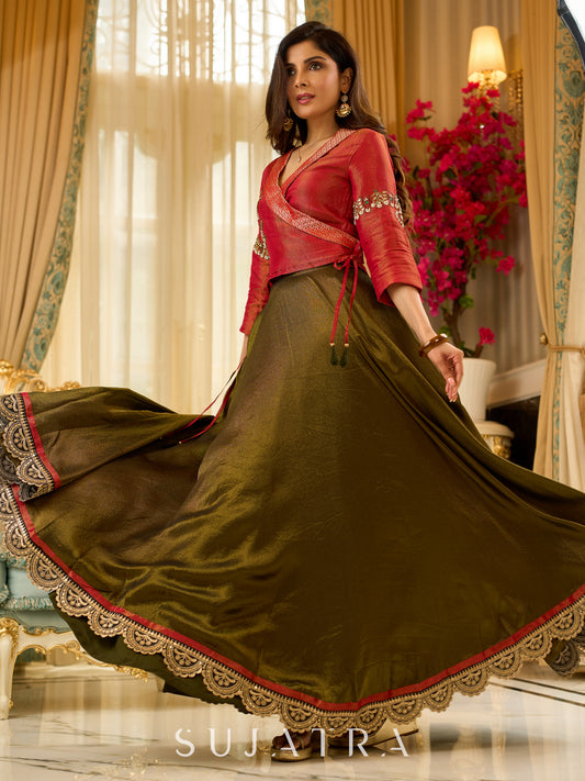 Luminous Green tissue lehenga with a classic Red Angrakha choli featuring intricate hand embroidery.