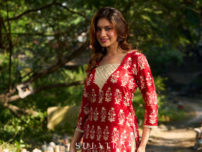 Vibrant red viscose short kurta showcasing a charming floral print, refined pintuck neck panel