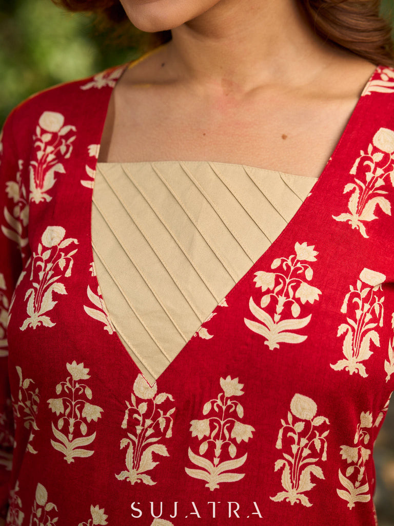 Vibrant red viscose short kurta showcasing a charming floral print, refined pintuck neck panel