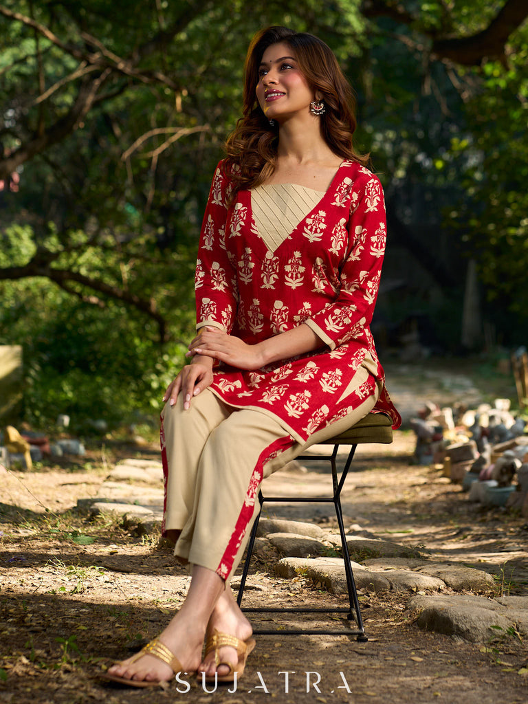 Vibrant red viscose short kurta showcasing a charming floral print, refined pintuck neck panel
