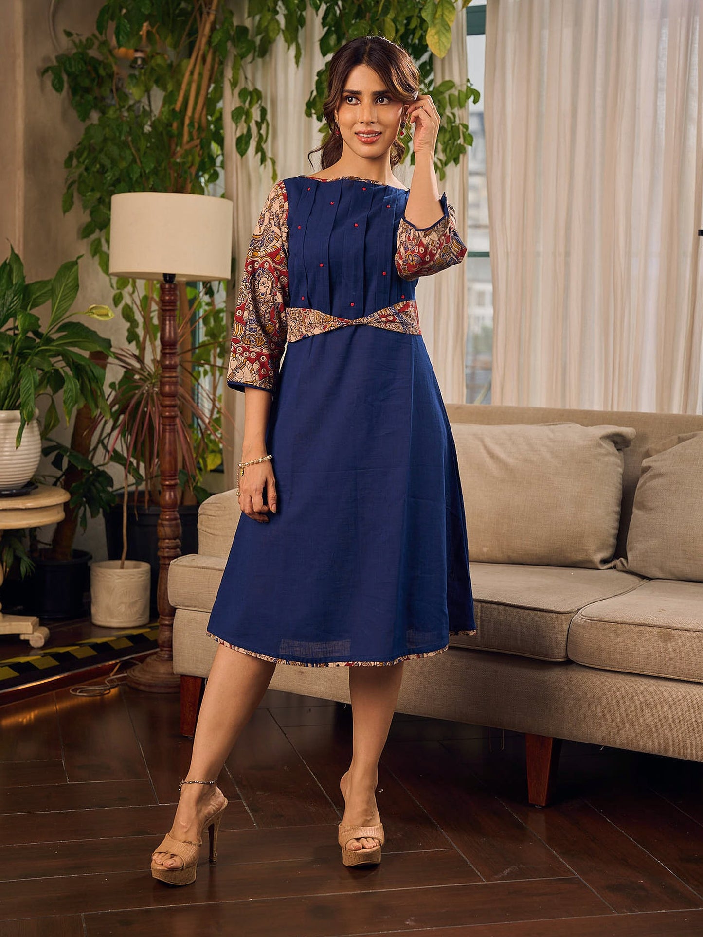 Navy Blue Artisanal Kalamkari prints enhanced with statement sleeves and a waist-defining knotted Kalamkari belt.